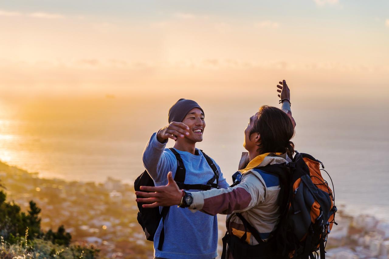 Smiling_hikers_going_for_a_hug.jpg