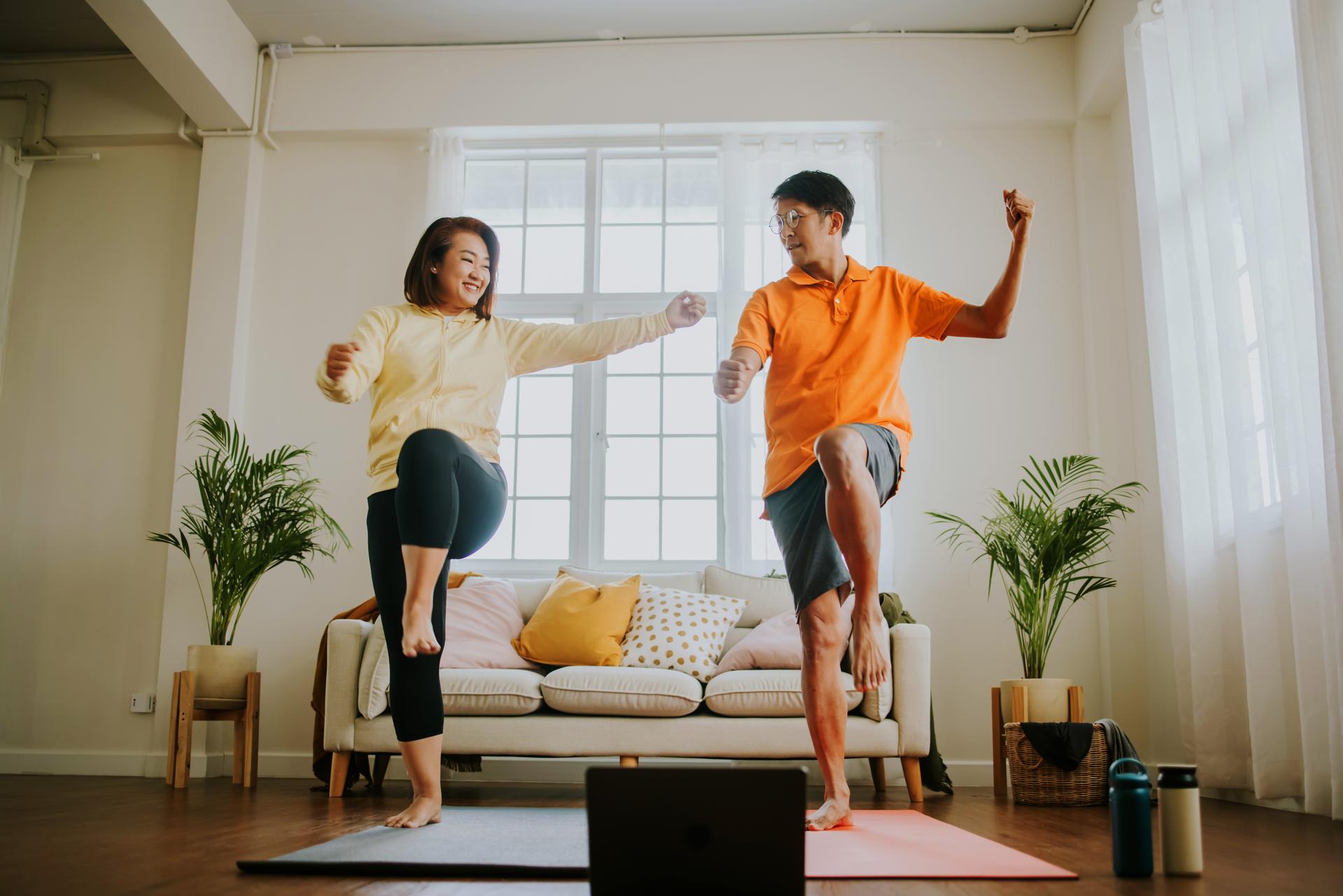 Couple_enjoy_exercising_and_aerobic_dancing_at_hom.jpg